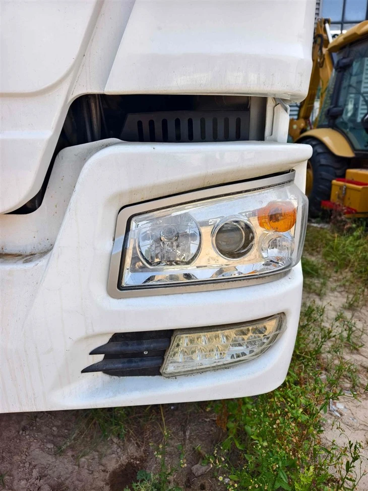 White HOWO Truck Front Headlight and Bumper Detail