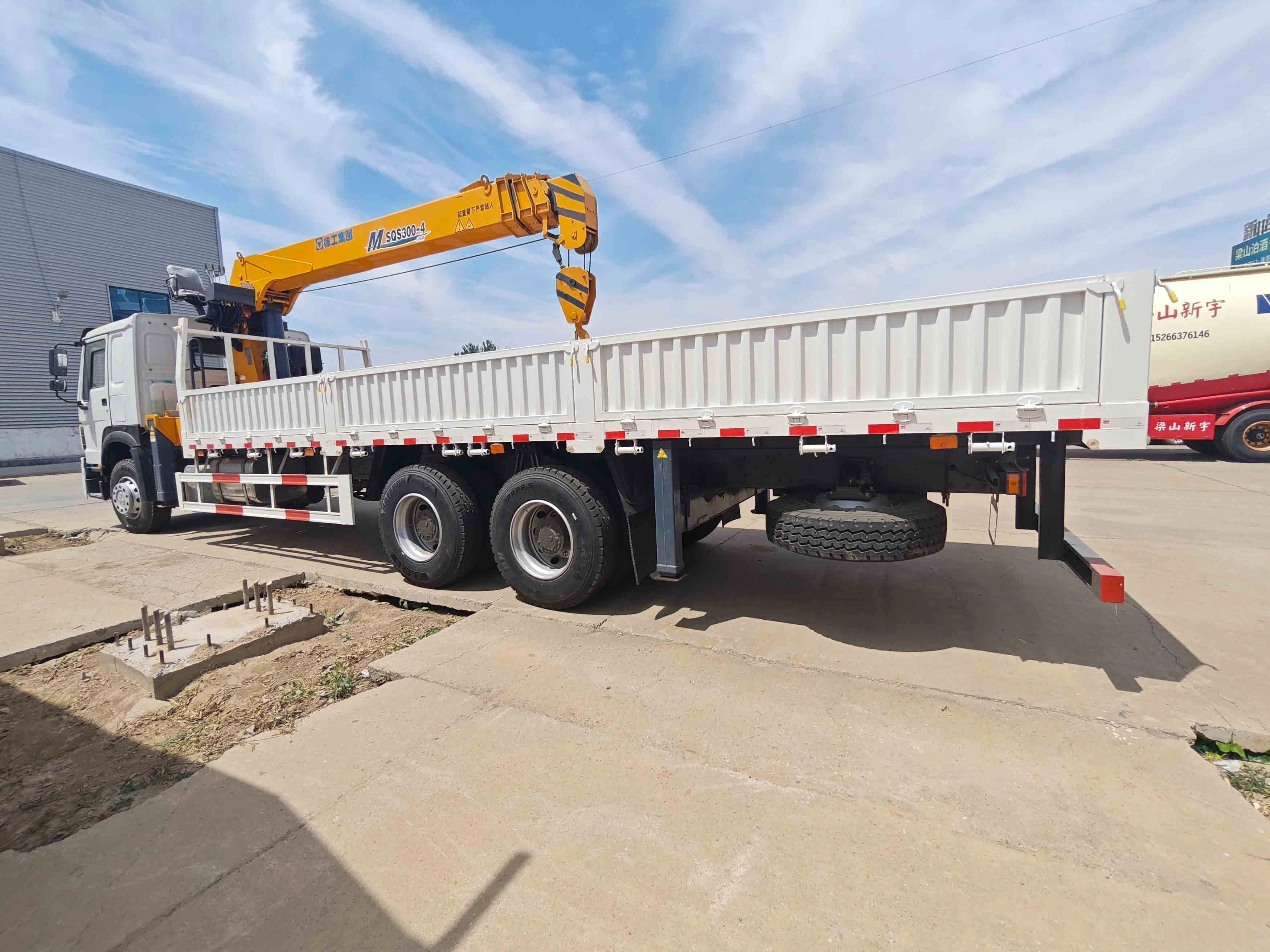 How does the suspension of a cargo truck affect the ride quality for the driver?